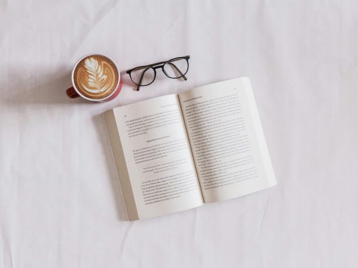 Dr. Neruda’s Cure for Evil book with coffee and glasses