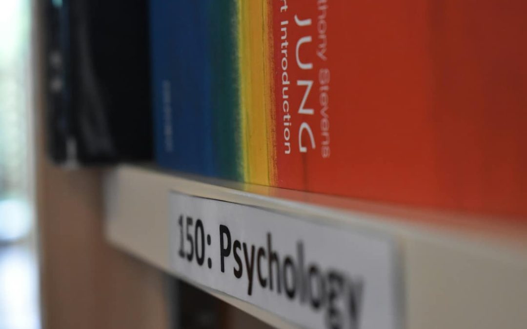 sychology books on a shelf, representing the study of Jungian and depth psychology
