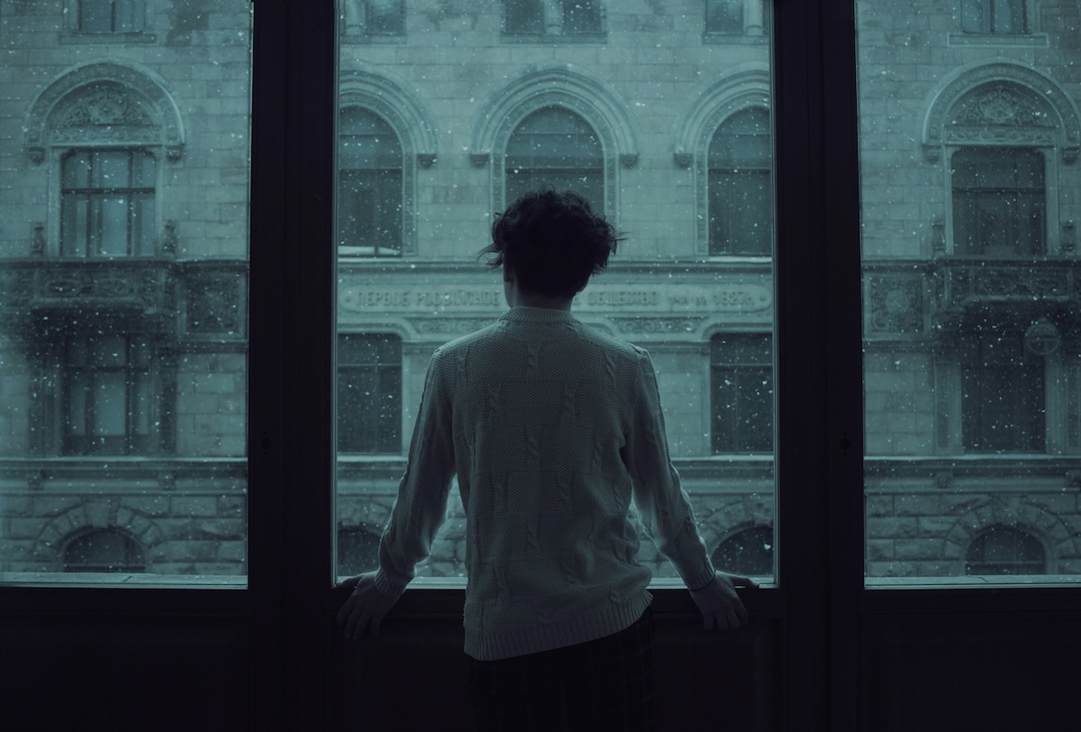 Man alone reflecting on self-worth and identity in Adlerian psychology and men’s therapy