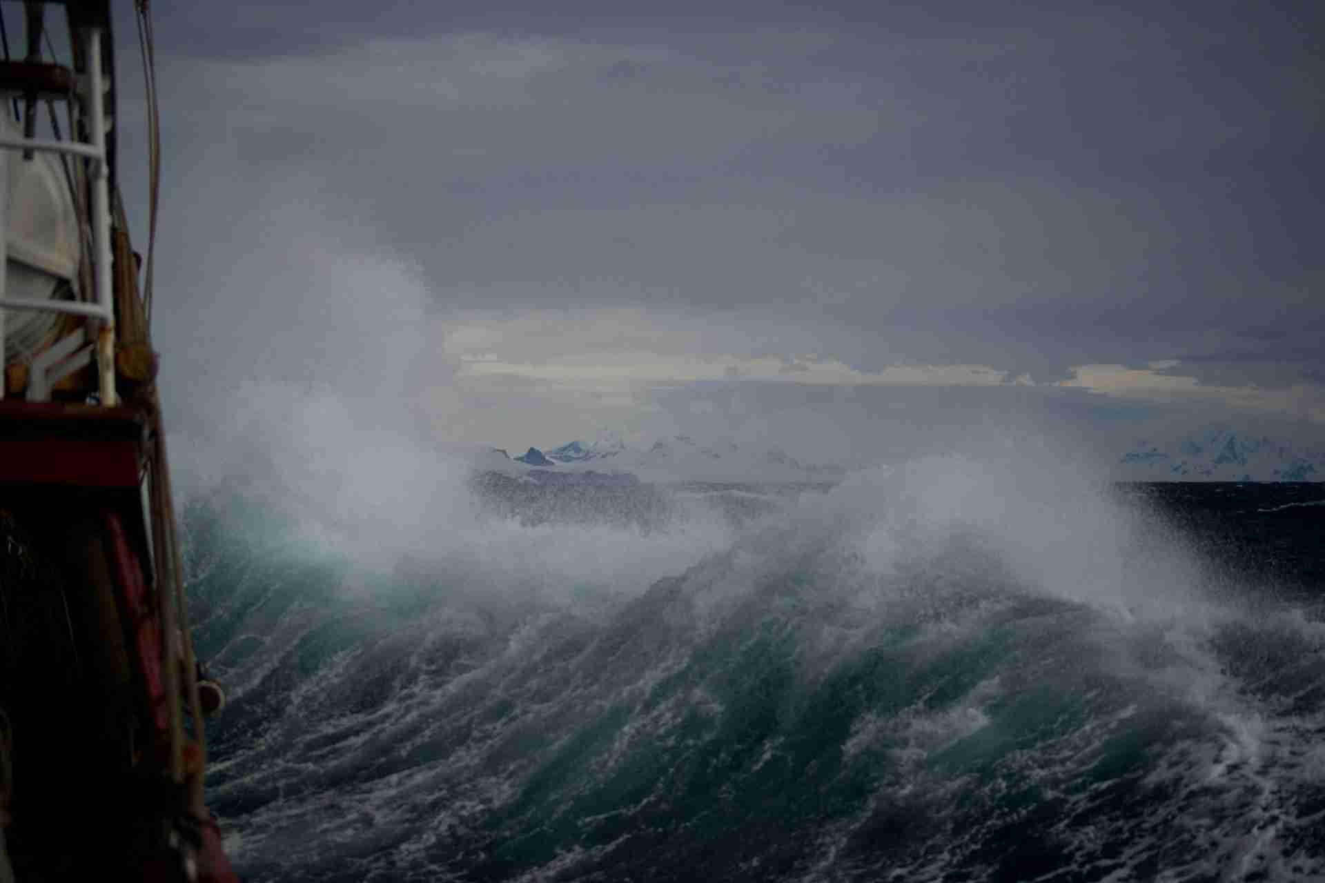 Rough, turbulent ocean waves crashing under a stormy sky, symbolizing emotional intensity and instability