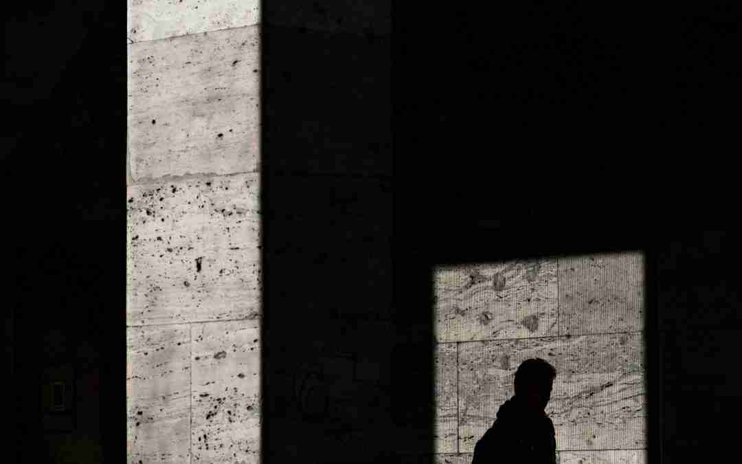Abstract light and shadow reflection illustrating Jungian shadow work and depth therapy